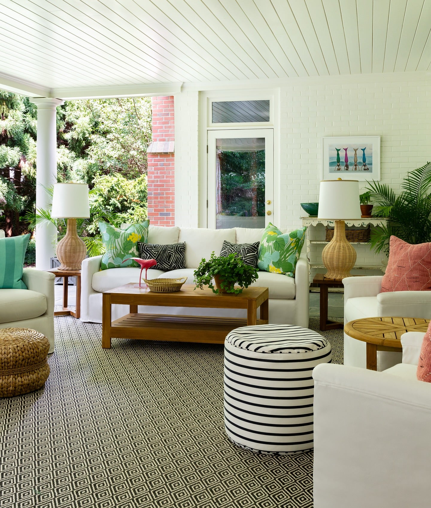 the bird,  a pink bird statement piece on a covered modern porch 